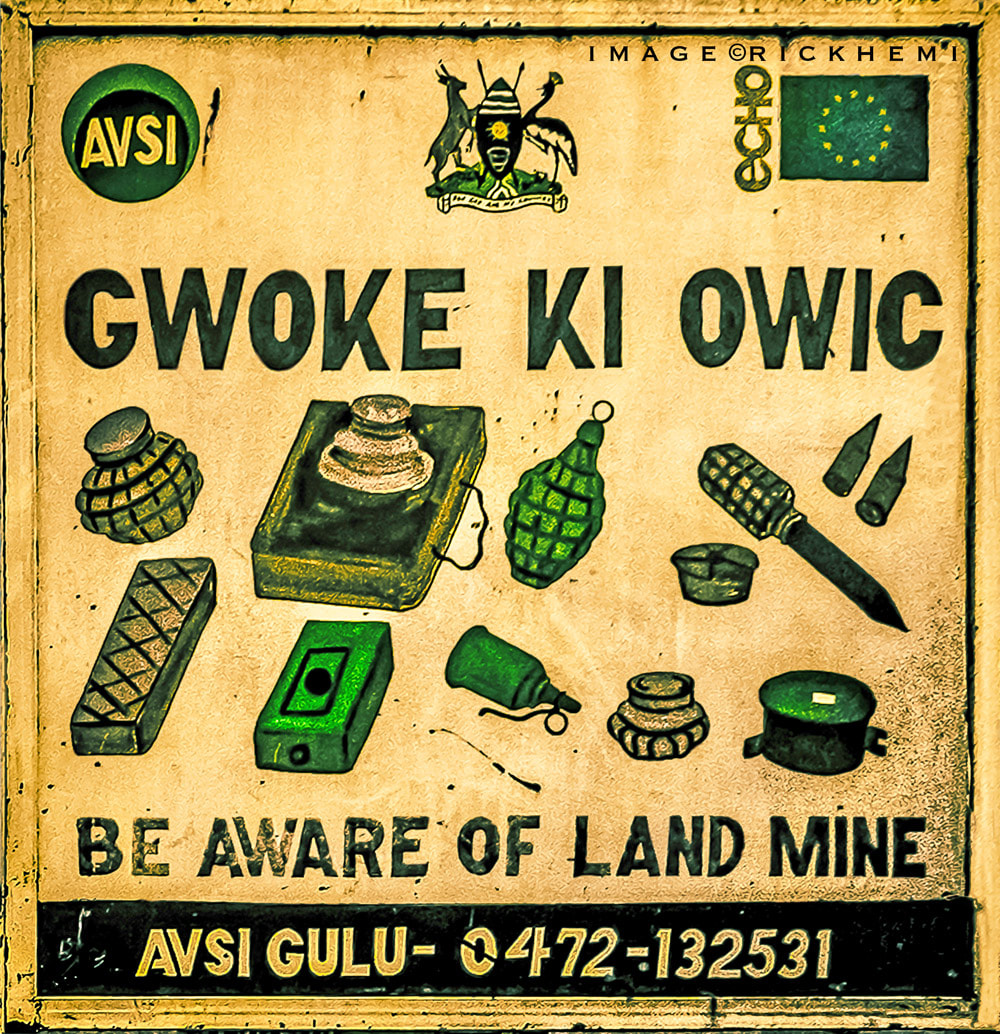 overland travel and transit Africa, land mine warning road sign image by Rick Hemi