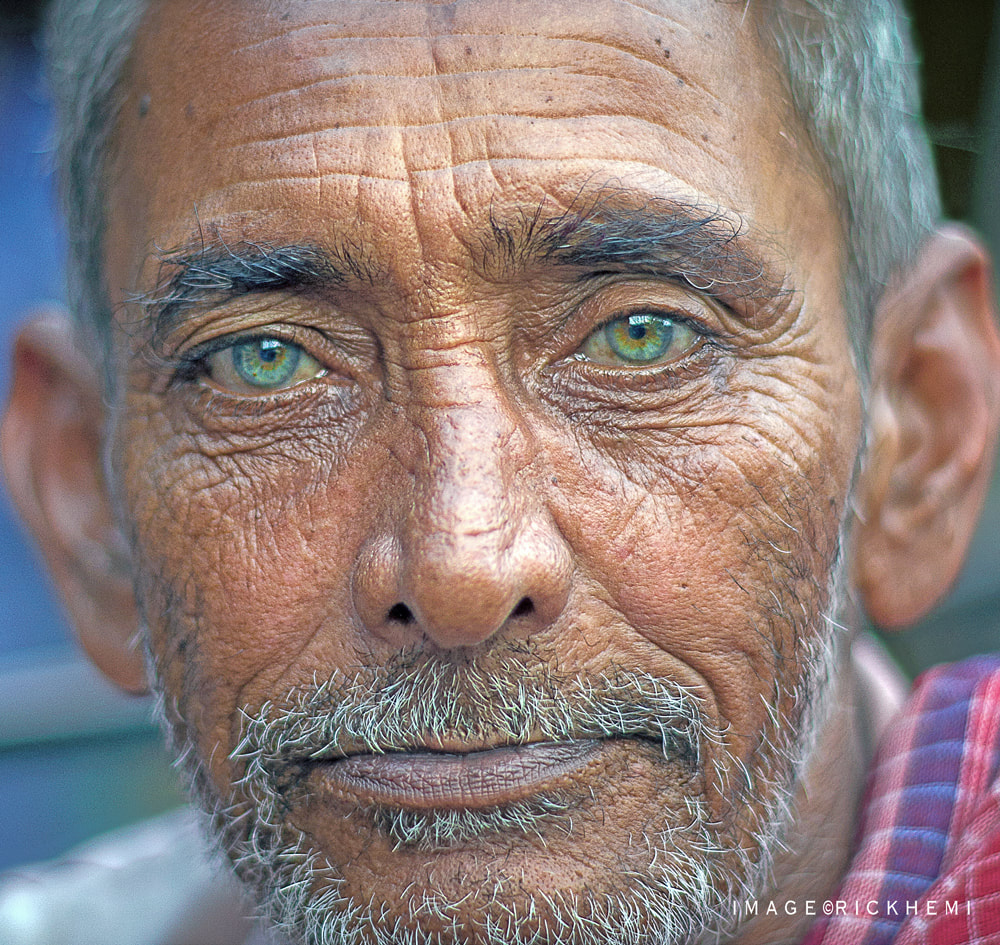 solo travel Asia, street closeup portrait, manual focus Nikon 105mm f/1.8 AIS lens, image by Rick Hemi