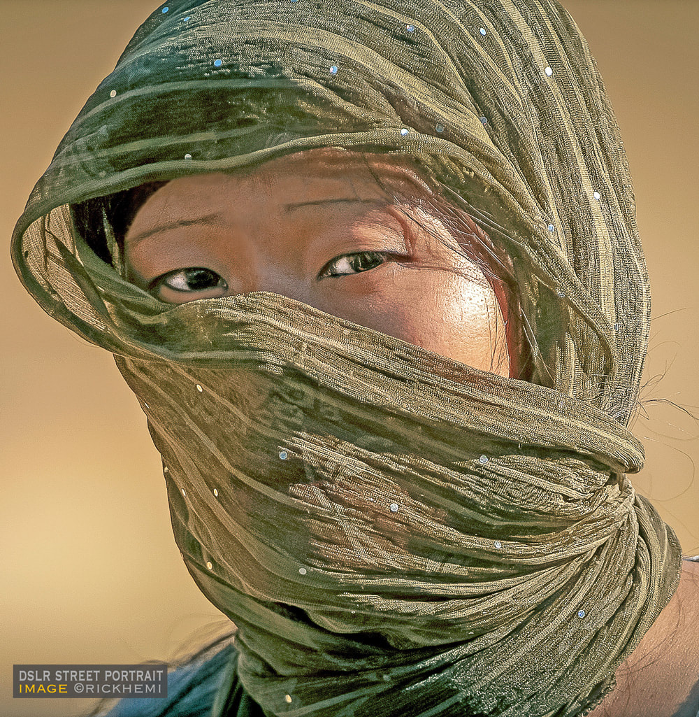 solo travel Asia, DSLR long shot 400mm on the go street portrait central Asia, image by Rick Hemi