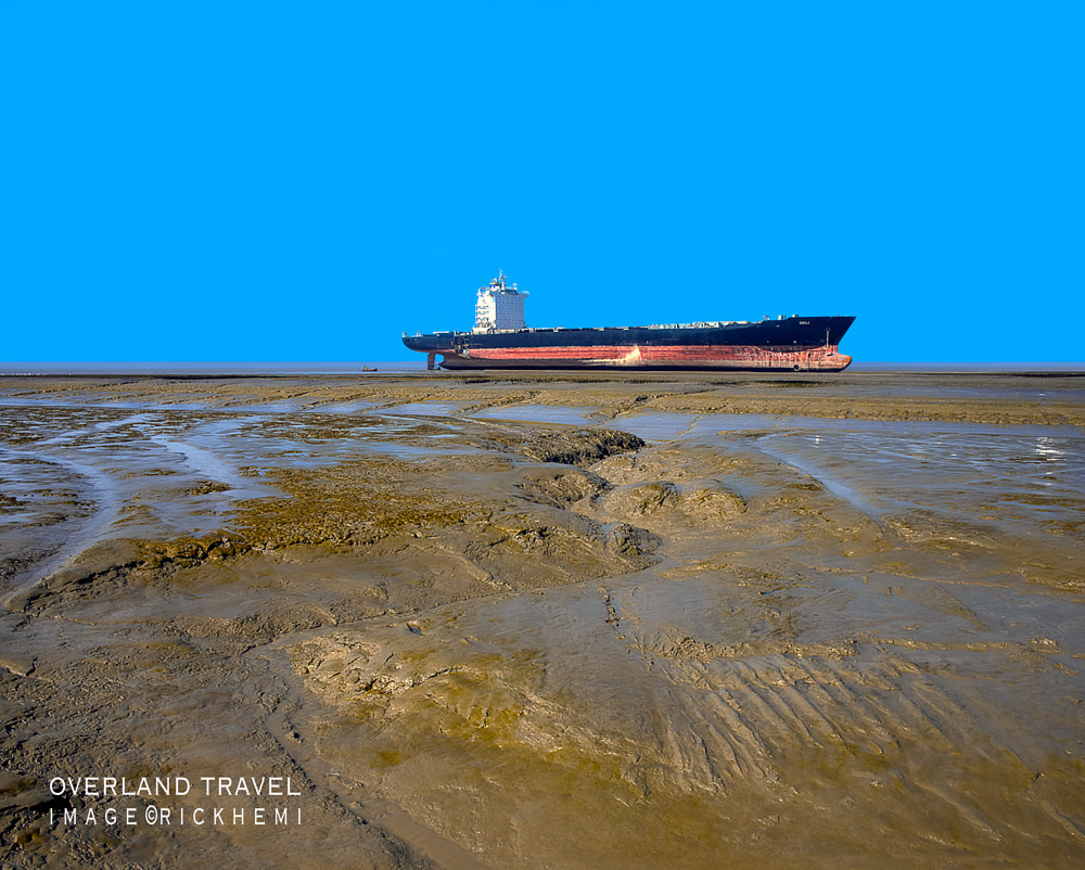 solo overland travel, mudflats low tide, DSLR image by Rick Hemi
