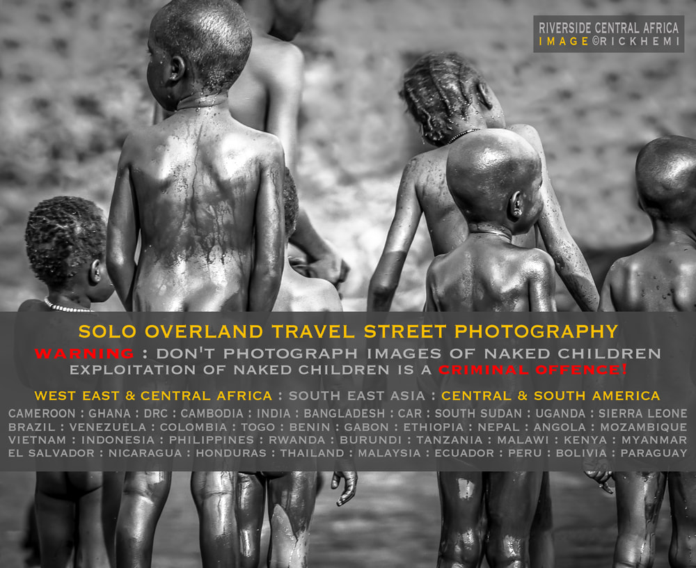 overland travel offshore, street photography, advisory warning, exploitation of naked children is a criminal offence, image riverside tribal heartland Africa by Rick Hemi