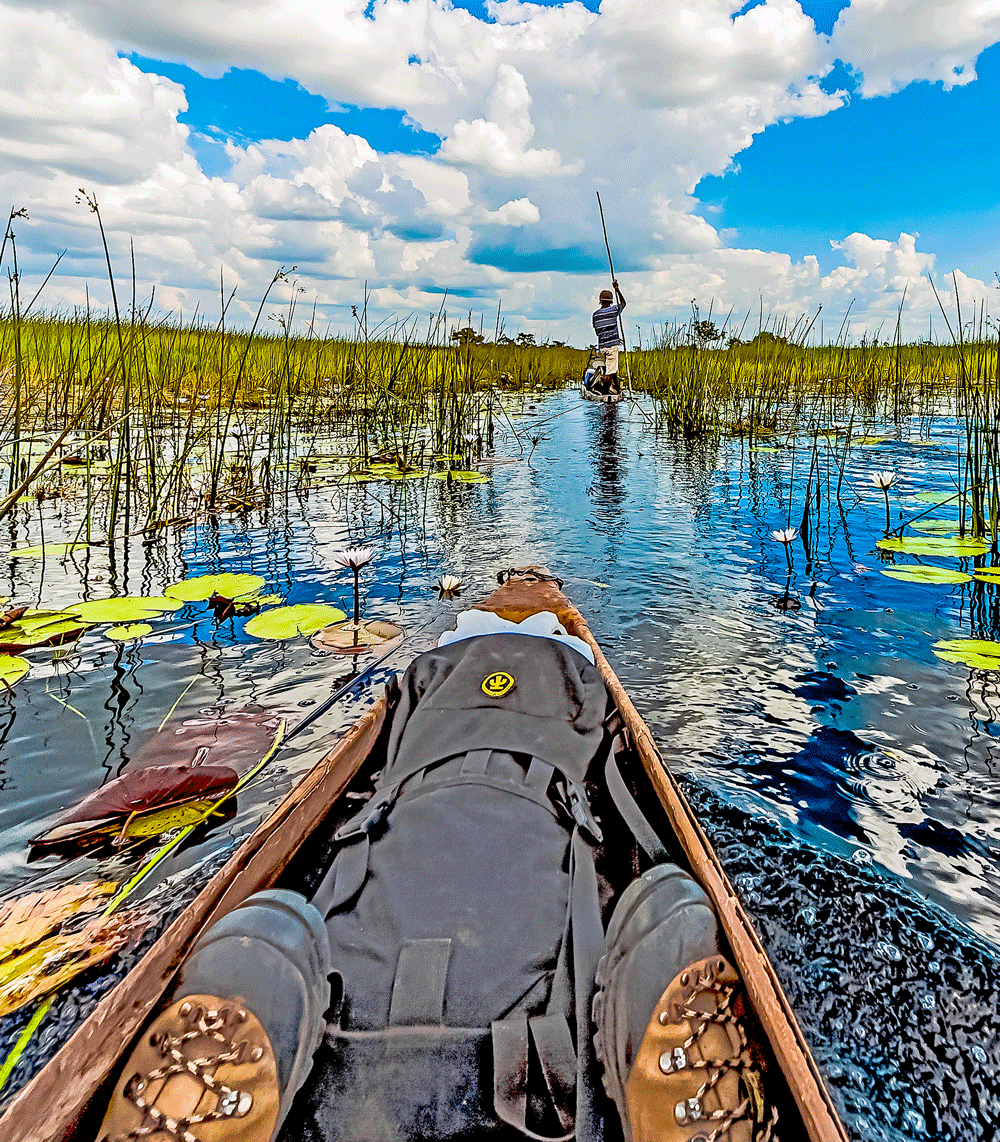 solo overland travel Africa, Okavango Delta, dugout image by Rick Hemi