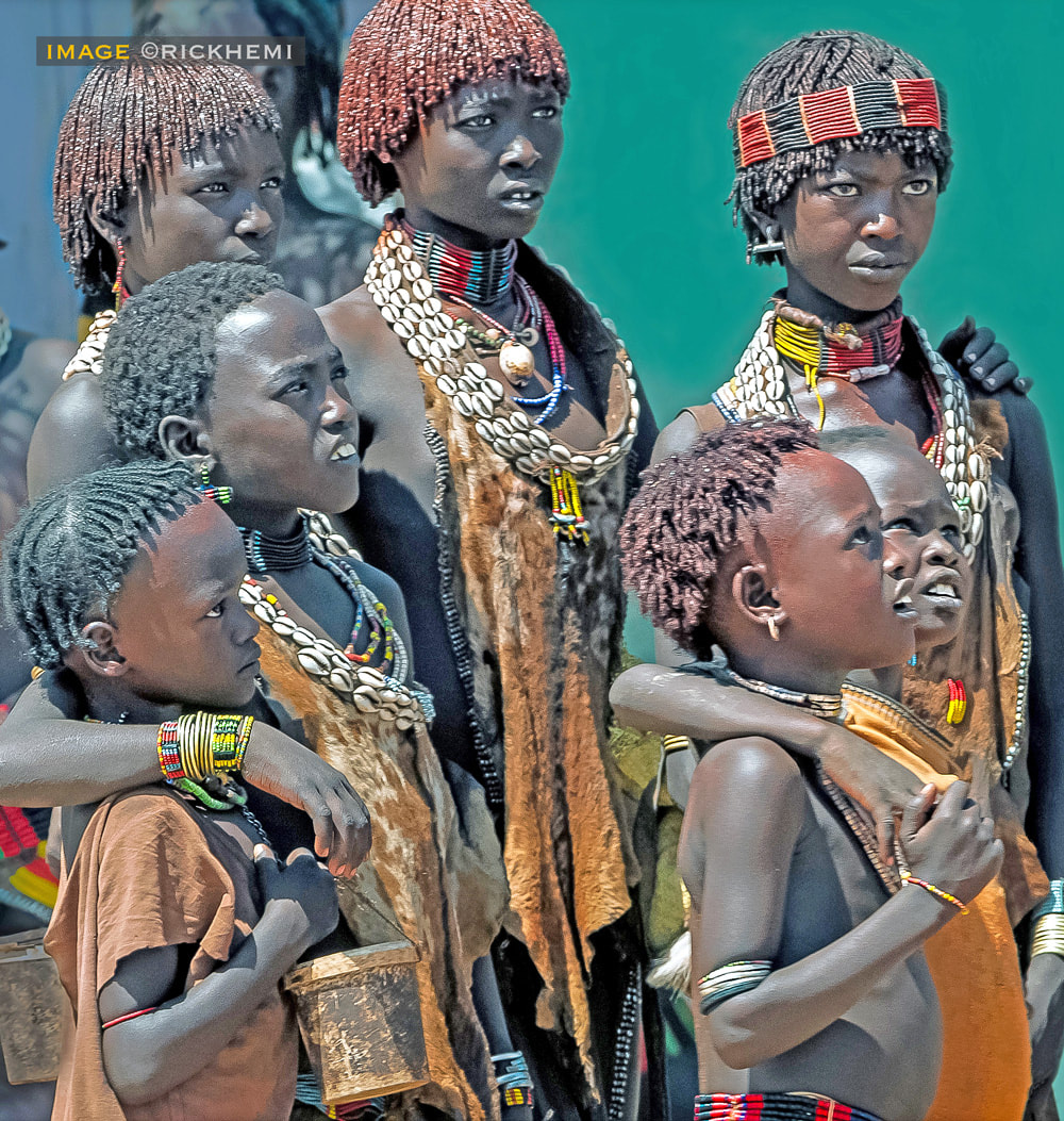 solo travel tribal lands Africa, village gathering, image by rick hemi