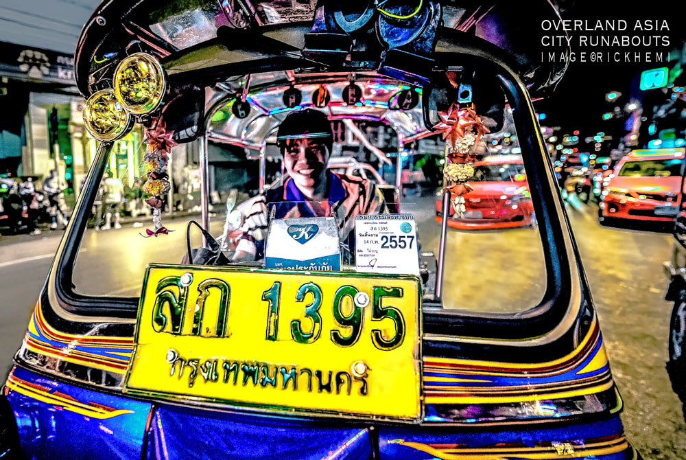 solo overland travel and transit Asia, tuk tuk rickshaw Bangkok, night image by Rick Hemi