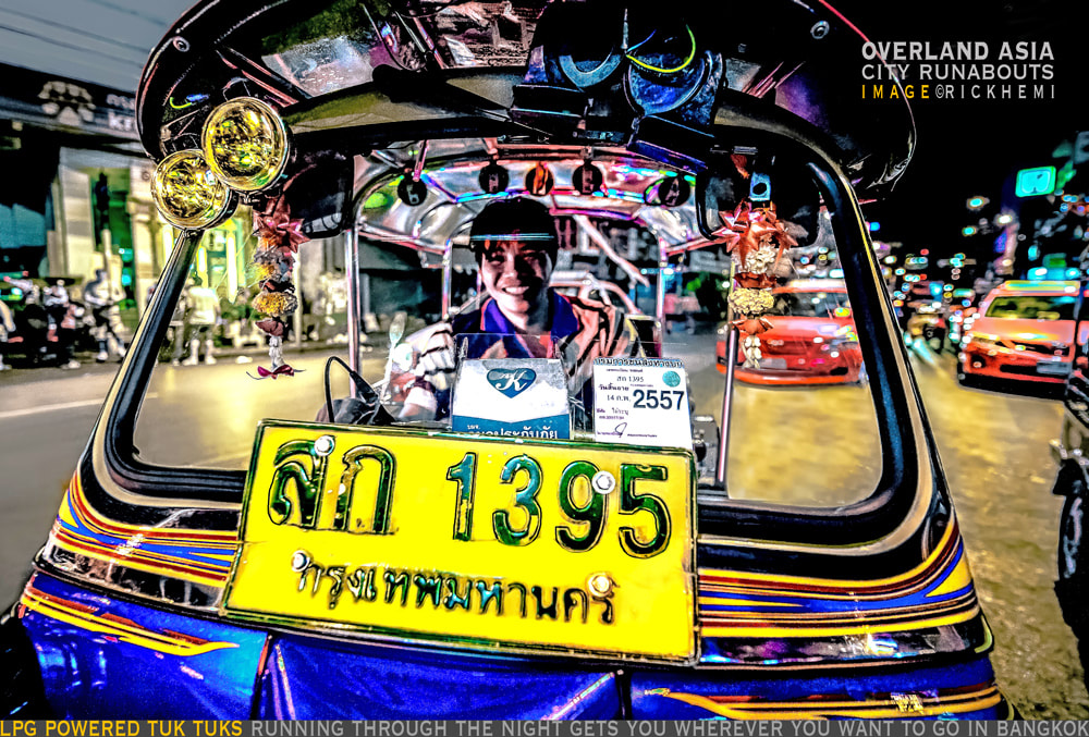 solo overland travel and transit Asia, tuk tuk rickshaw Bangkok, night image by Rick Hemi