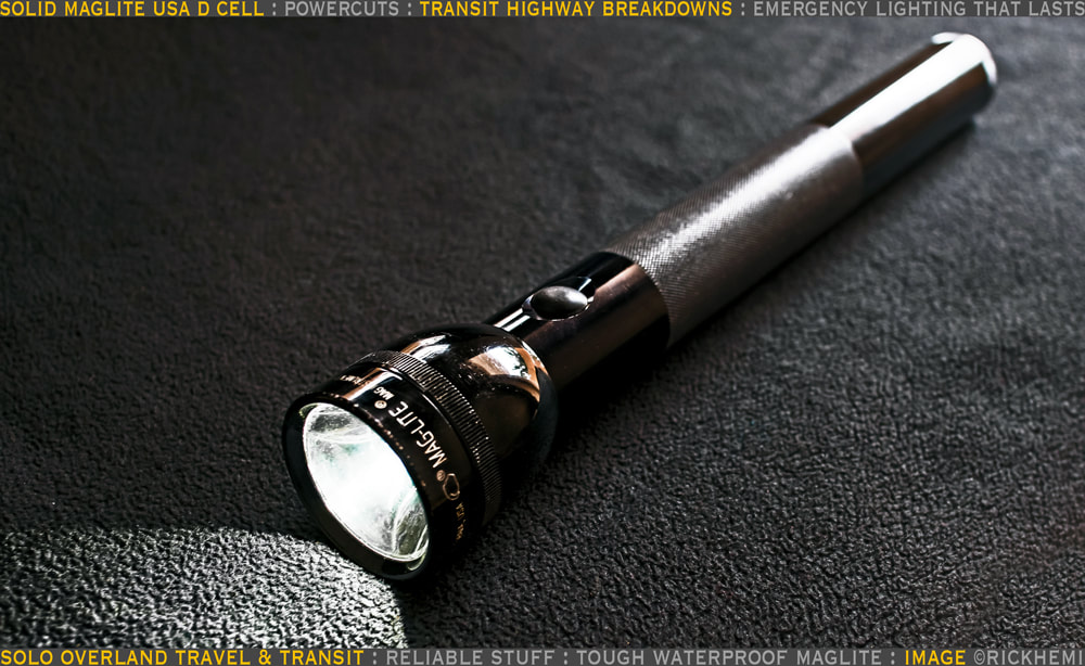 solo overland travel and transit offshore baggage stuff, MagLite USA D cell torch, transit breakdowns,  power-cuts,  backup emergency lighting,  image by Rick Hemi
