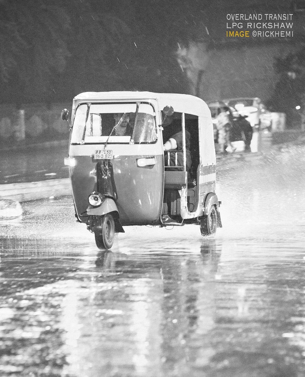 solo overland travel and transit, night monsoon rickshaw  in transit, image by Rick Hemi