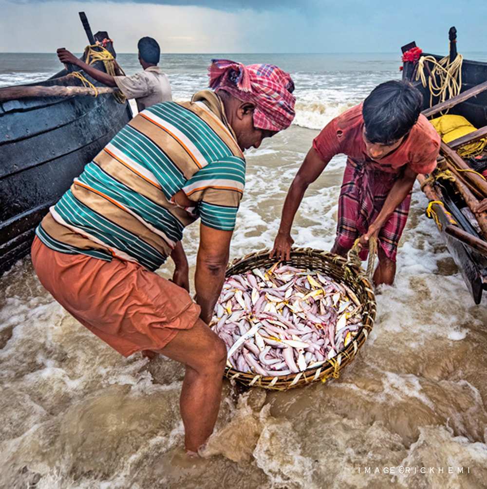 solo overland travel Asia, coastline fisherman Asia, image by Rick Hemi
