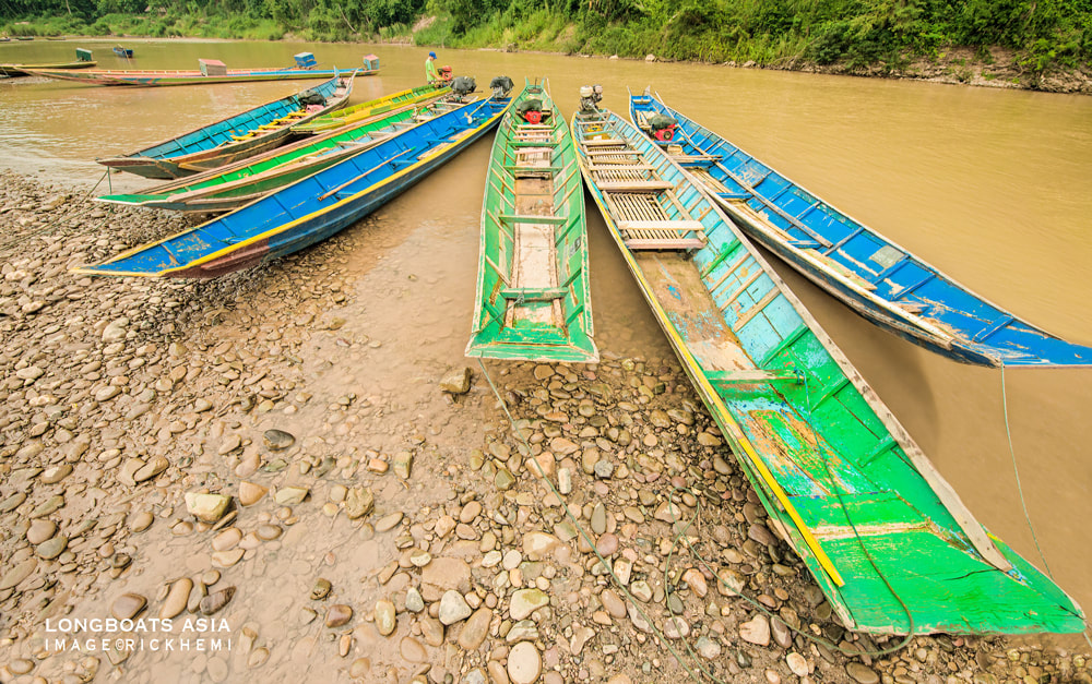 solo travel Asia. longboat transport, image by Rick Hemi