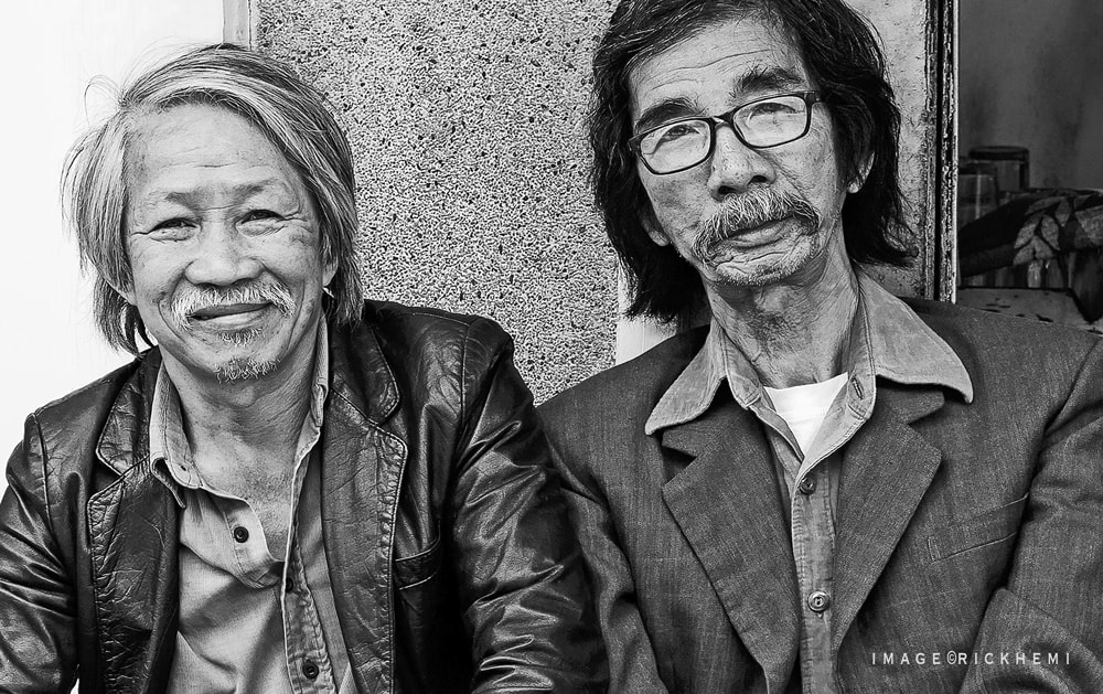 Asia solo overland travel, street portrait, best mates, image by Rick Hemi