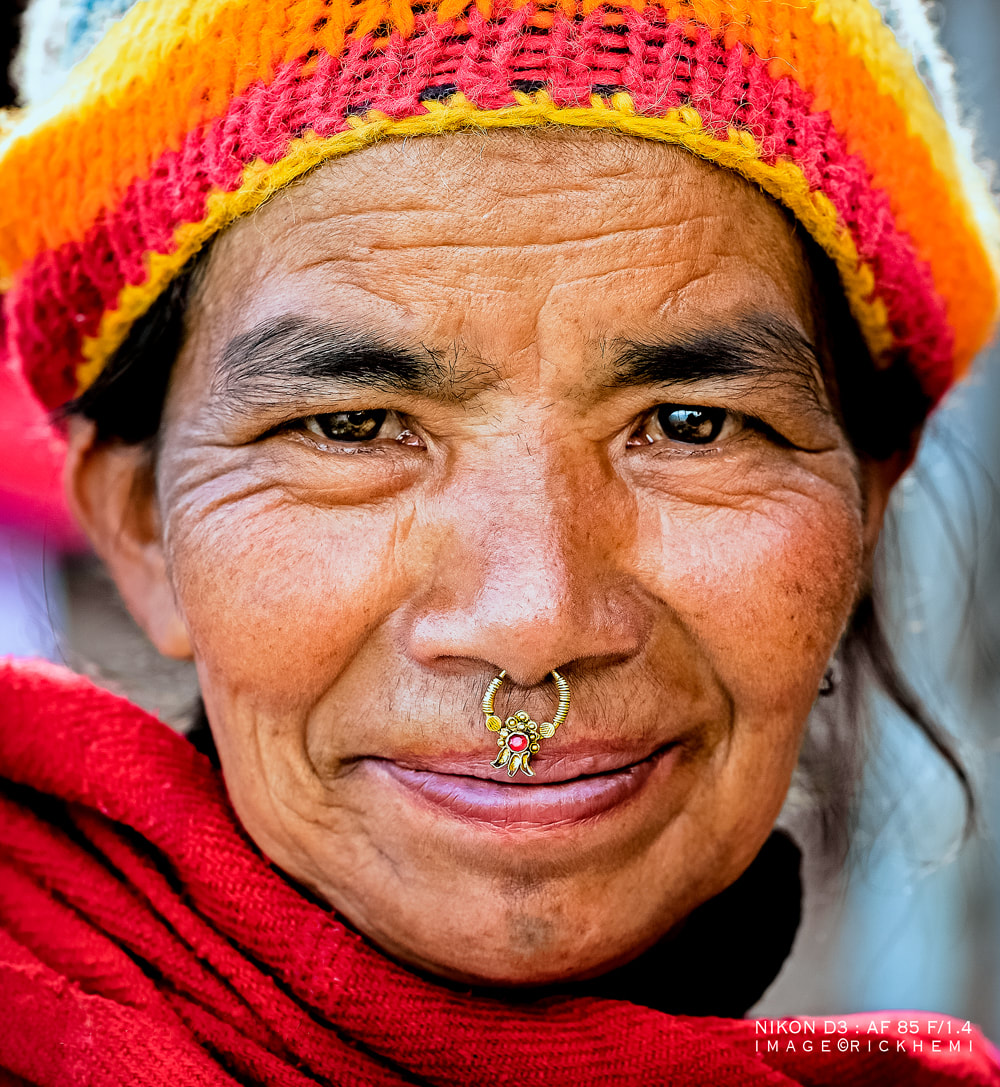 solo overland travel Asia, street photography people shots, Nepali closeup, image by Rick Hemi