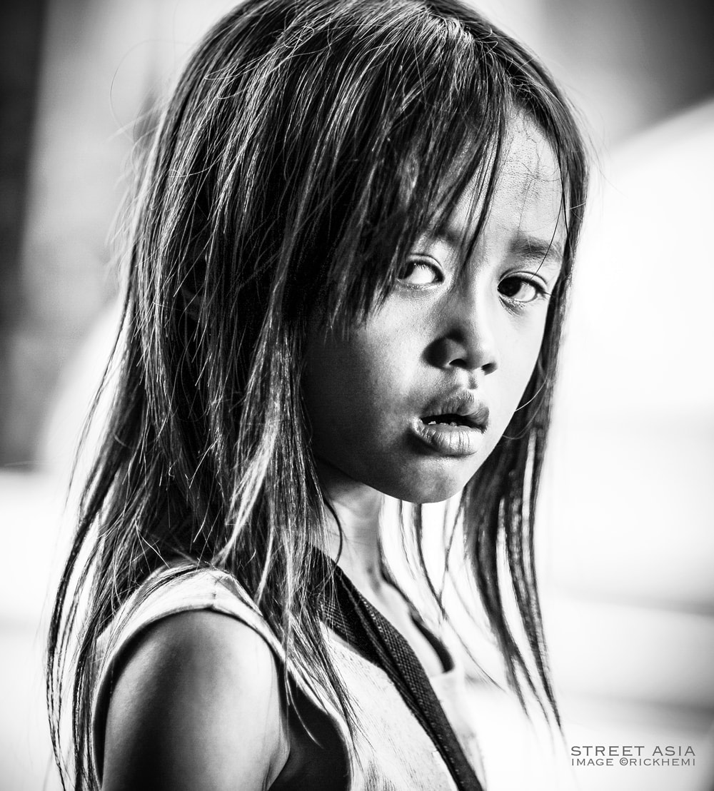 overland travel Asia, tourist ghetto street shot image, report child prostitution, image by Rick Hemi 