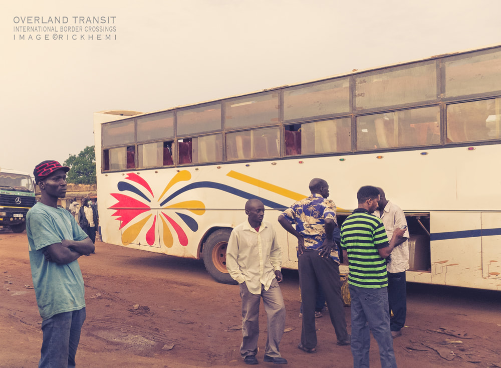 solo overland transit Africa, bush bus travel journeys, international border crossing image snap by Rick Hemi