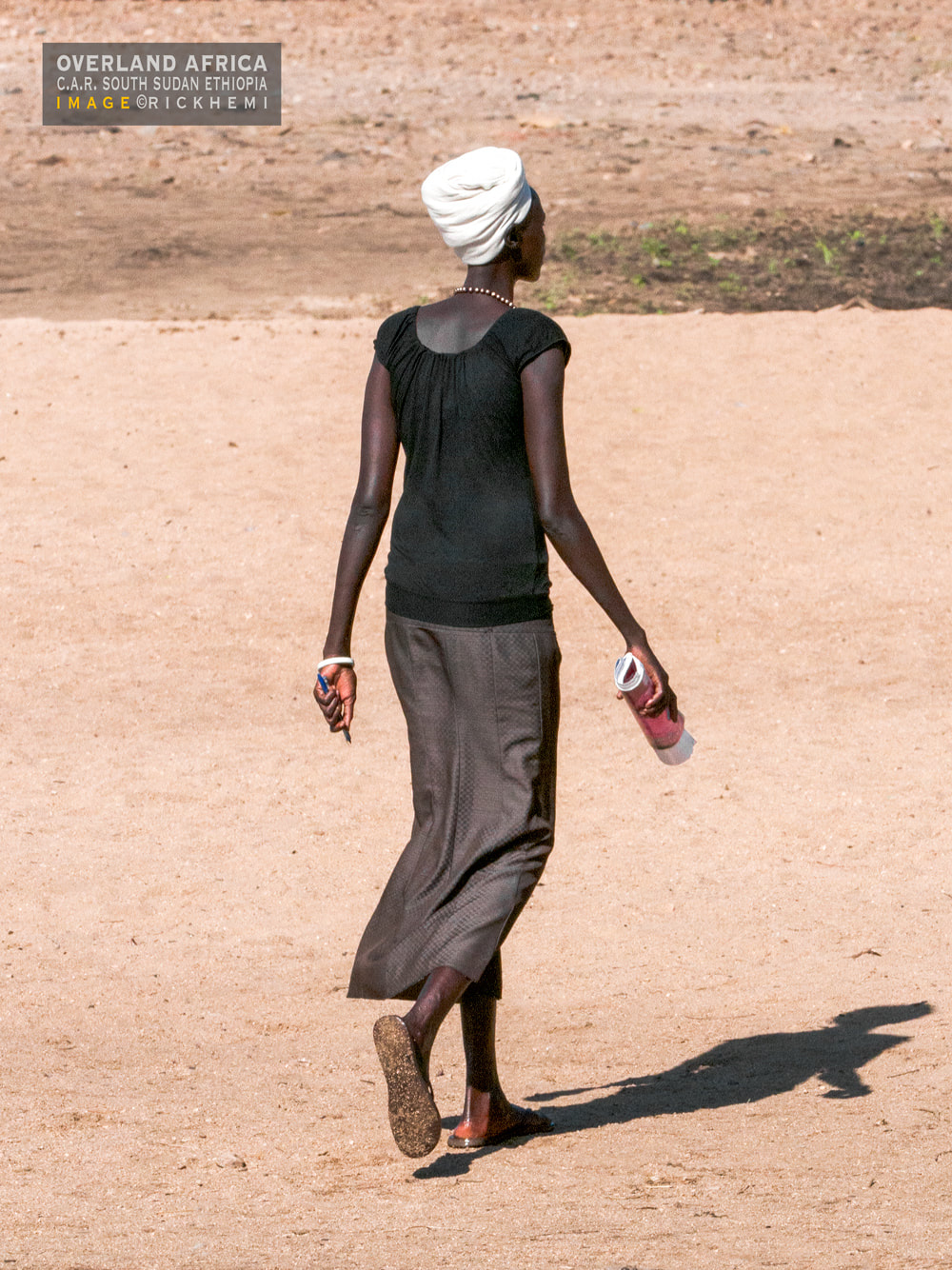 solo overland travel Africa, tall slim African beauty, image by Rick Hemi