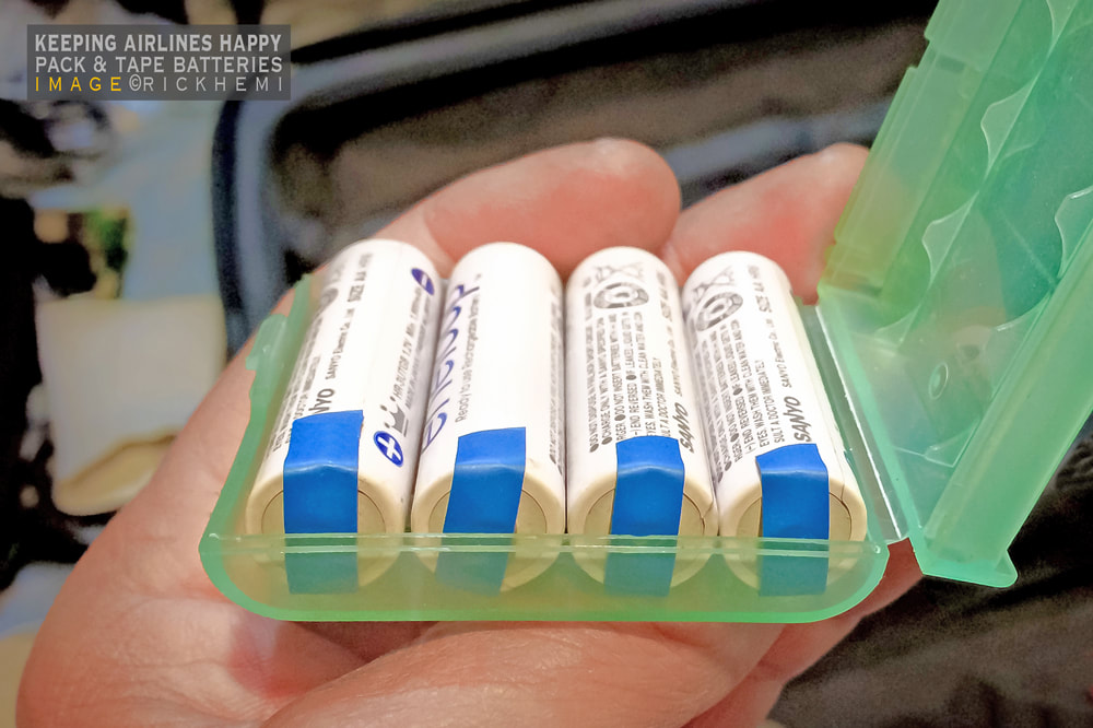 solo overland travel and transit offshore baggage stuff, AA and AAA rechargeable batteries in checked airport baggage, image by Rick Hemi