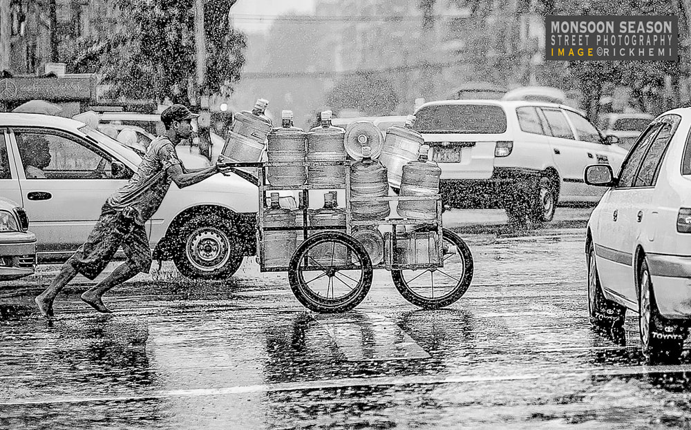 Asia monsoon wet season, street photography Asia, image by Rick Hemi